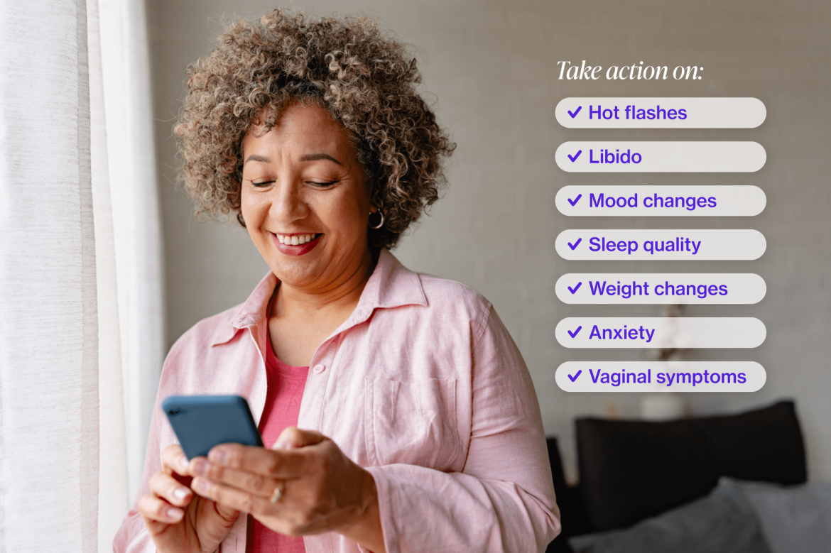 Symptom overlay Middle-aged woman with curly hair wearing a pink shirt and looking at her iphone smiling.